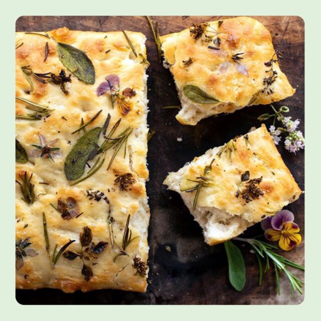 To celebrate the first official day of Spring, we highlight the whimsically colorful and rustic Italian snack, Flower Focaccia. 🌷🥖

A few toppings you can use to create a beautiful garden landscape on your bread:
- Edible flowers – such as pansy, lavender, daisy, chamomile, violet, marigold, etc..
- Bell peppers (large or mini) – thinly sliced
- Cherry tomatoes – whole or cut in half
- Olives – whole or cut in half
- Roasted garlic
- Asparagus – long stems
- Zucchini – thinly shaved and rolled into a bouquet